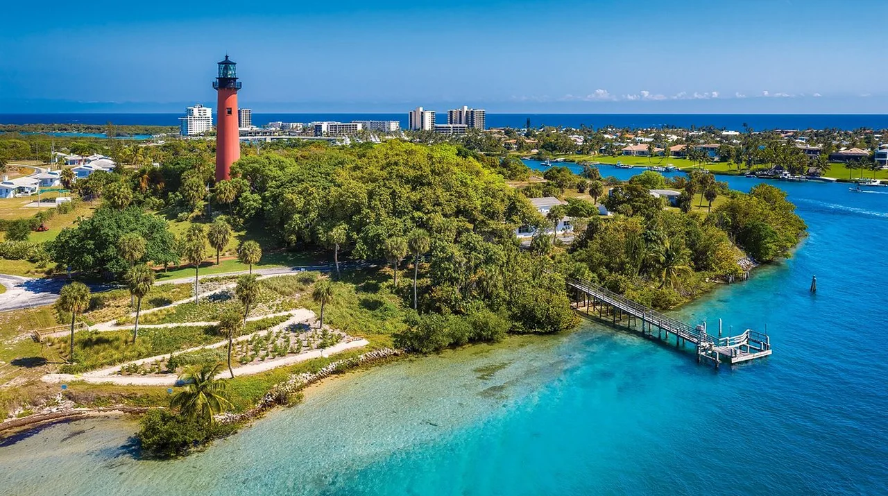 The Jupiter Inlet Lighthouse above the turquoise water of the Jupiter Inlet in Jupiter, Florida