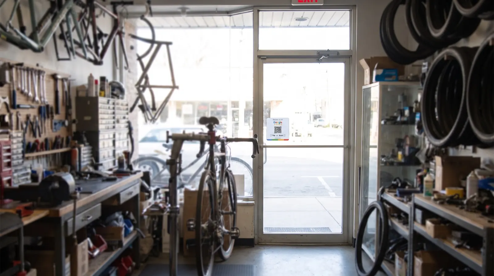 Card by the exit door of a bike shop